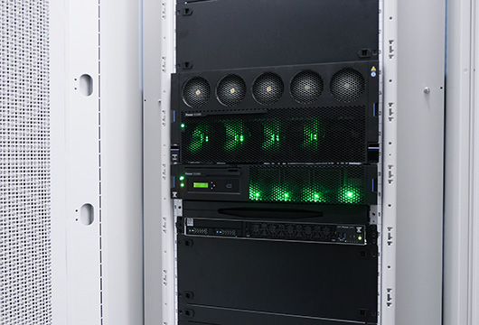 A close up image of the blinking lights on equipment in an equipment rack