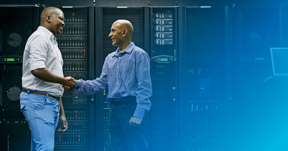 business partners shaking hands in a data center