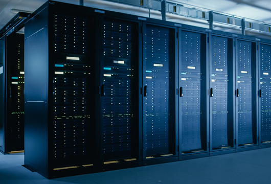 An image of a row of equipment within a data center