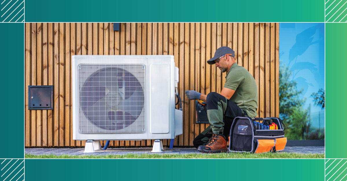 An image of a worker inspecting an HVAC unit