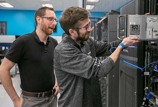Two Engineers Replacing Data Centre Hardware