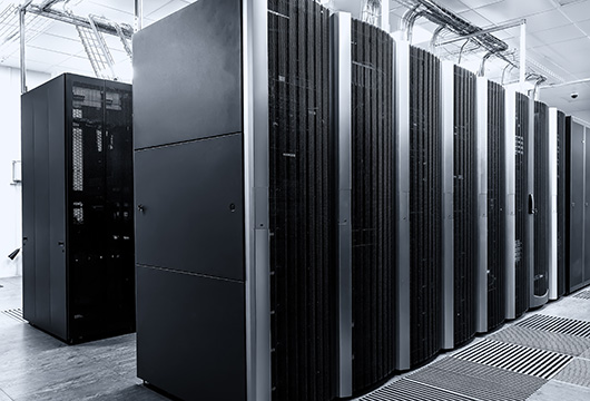An image of two rows of servers in a data center