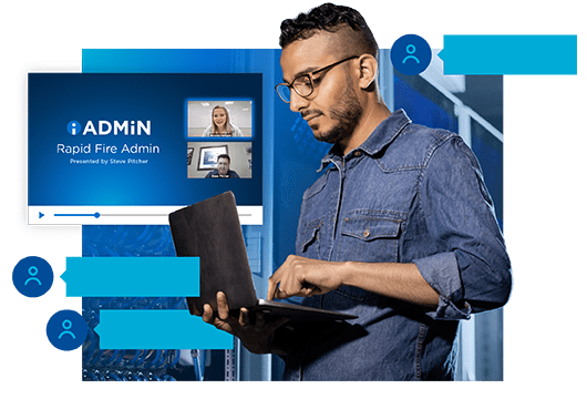 IT professional holding laptop watching iAdmin